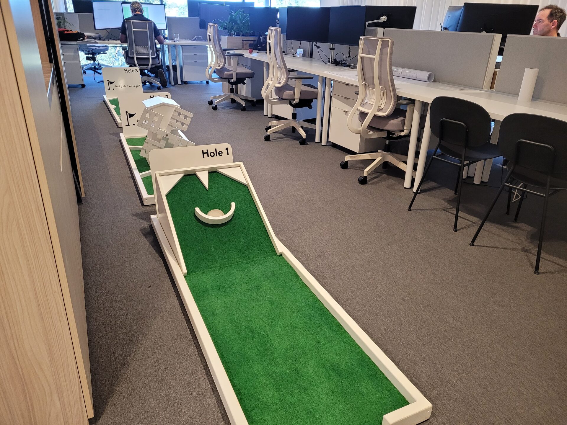 Lucky Shot white mini golf course installed in a Melbourne corporate office