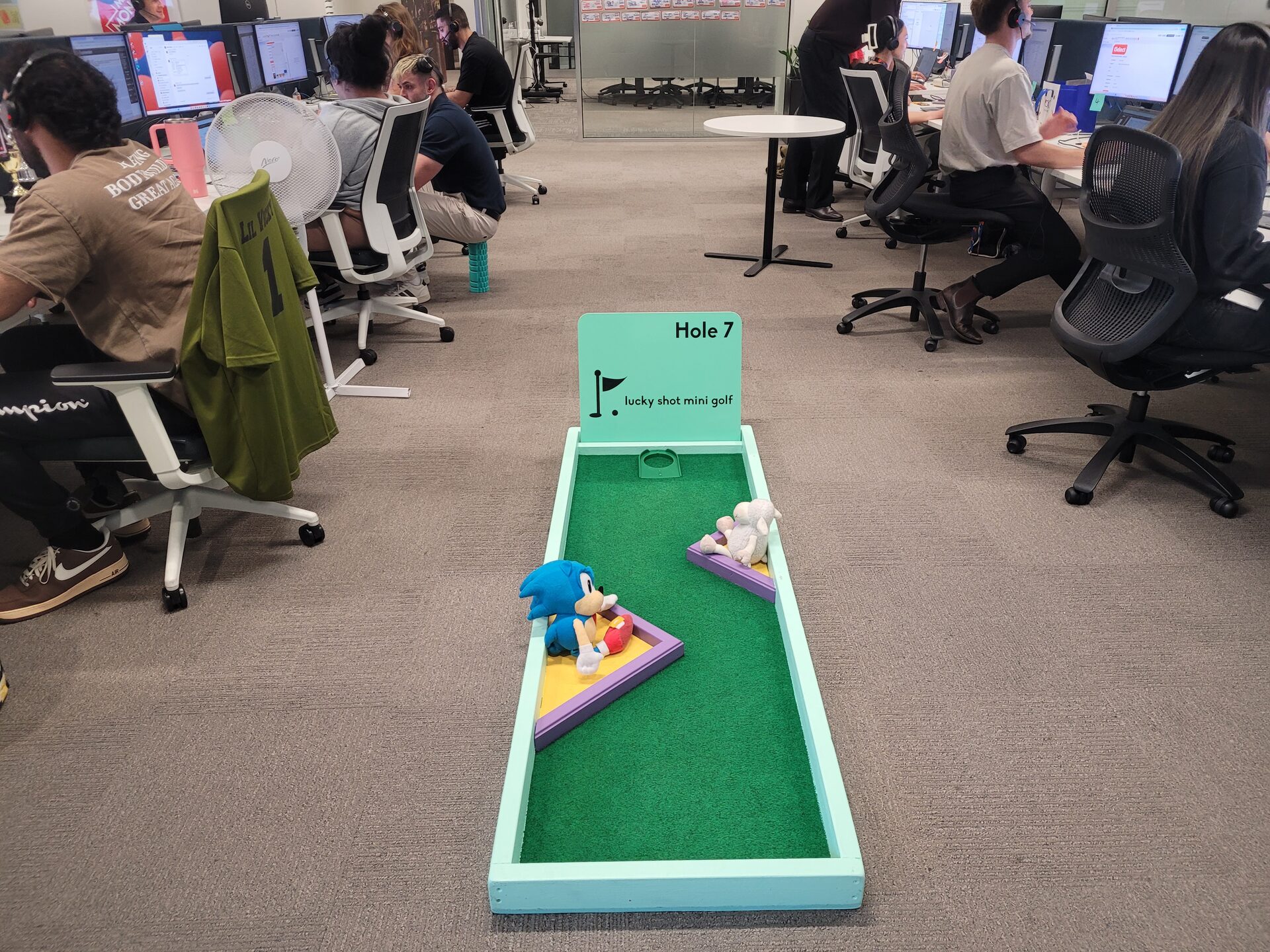 Mini golf hole installed in a real Melbourne office with staff at their desks