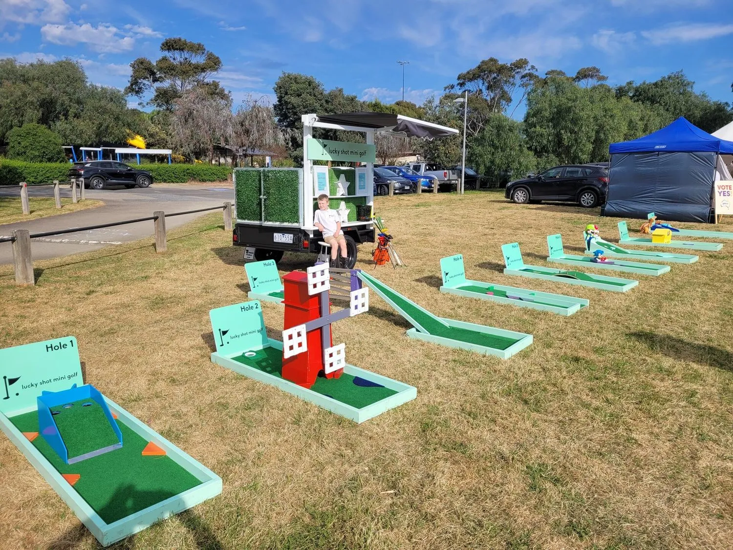 Lucky Shot branded outdoor activation with mobile course truck at park venue