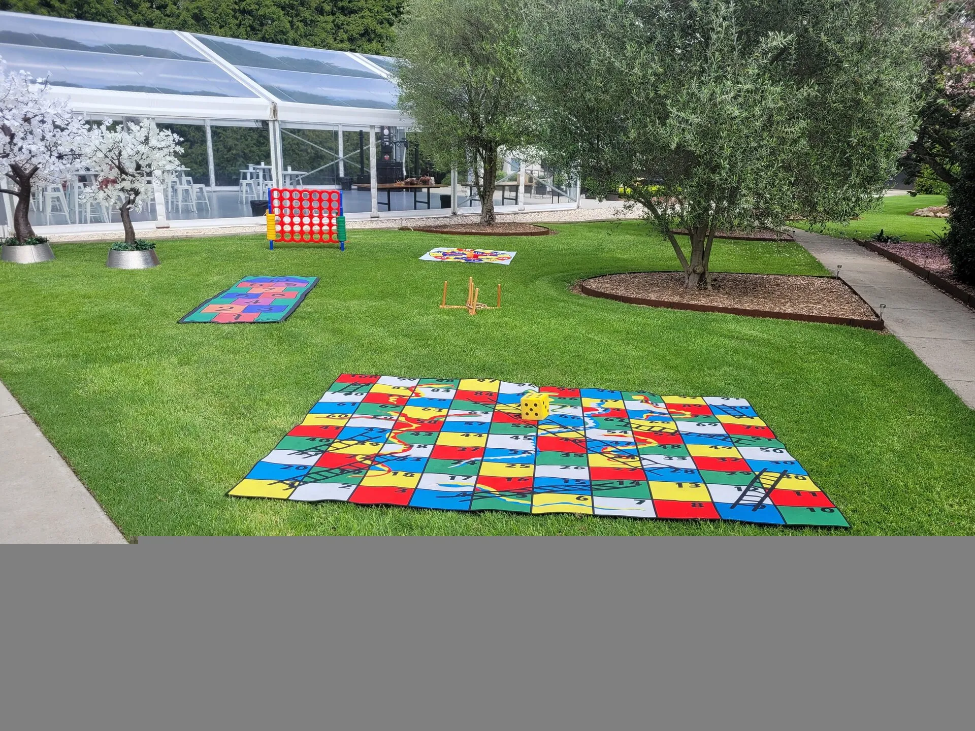 Giant lawn games set up at Melbourne wedding, Snakes and Ladders and Connect Four