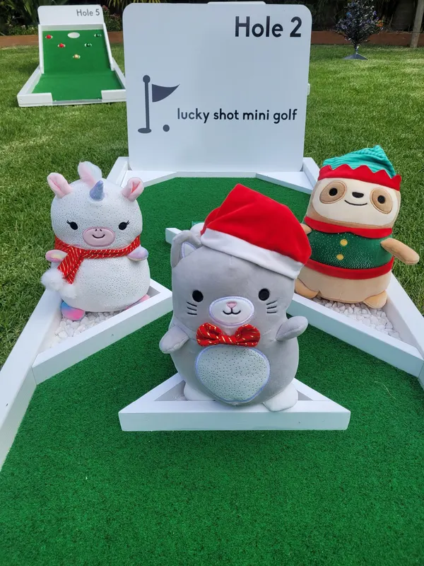 Lucky Shot Christmas themed mini golf in a Melbourne office, Santa figurine alongside Mario character cutouts