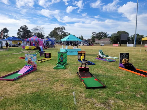 Lucky Shot Mini Golf course set up at a Melbourne park near a playground