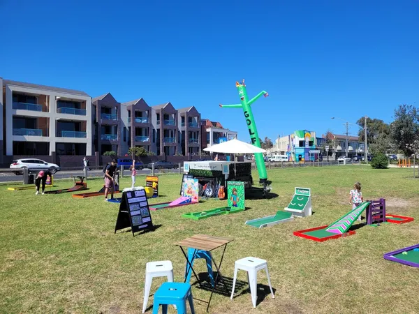 Lucky Shot Mini Golf set up on lawn outside a Melbourne university campus building