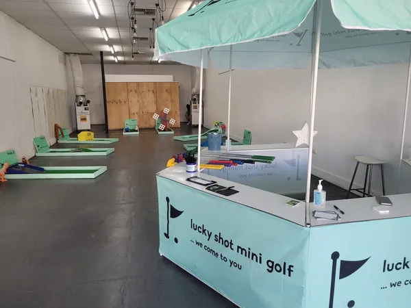 Lucky Shot Mini Golf showcased at a Melbourne corporate expo with branded marquee and full course laid out