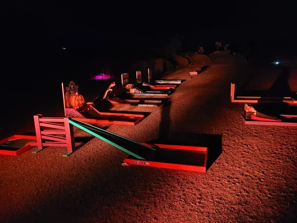 Lucky Shot Mini Golf themed course inside a dimly lit Melbourne corporate venue