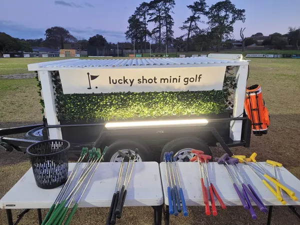 Lucky Shot Mini Golf branded display at an outdoor Melbourne community event