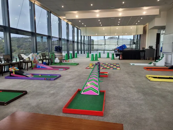 Lucky Shot Mini Golf course visible through floor-to-ceiling windows of a premium Melbourne office