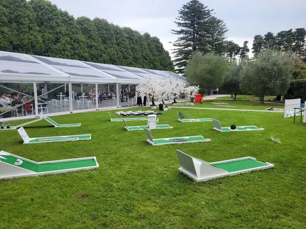 Lucky Shot Mini Golf and lawn games next to a white marquee at a Melbourne wedding