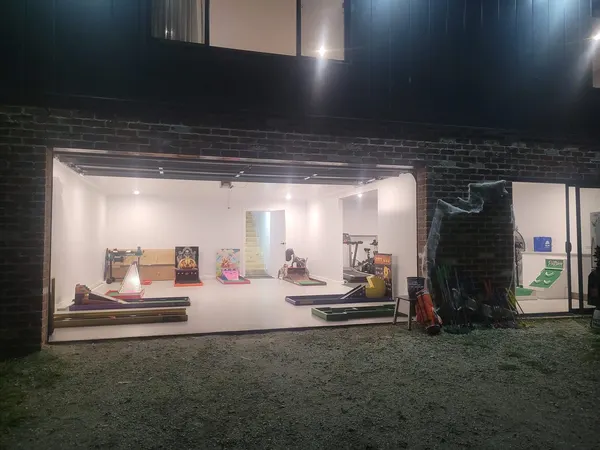 Lucky Shot Mini Golf installation in a darkened Melbourne corporate venue with branded display lit up