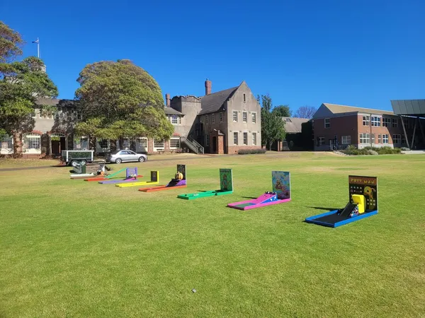 Lucky Shot Mini Golf course on the lawn at Monash University Melbourne with heritage building in background