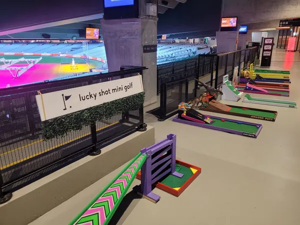 Lucky Shot Mini Golf course laid out across a Melbourne office floor with branded greens
