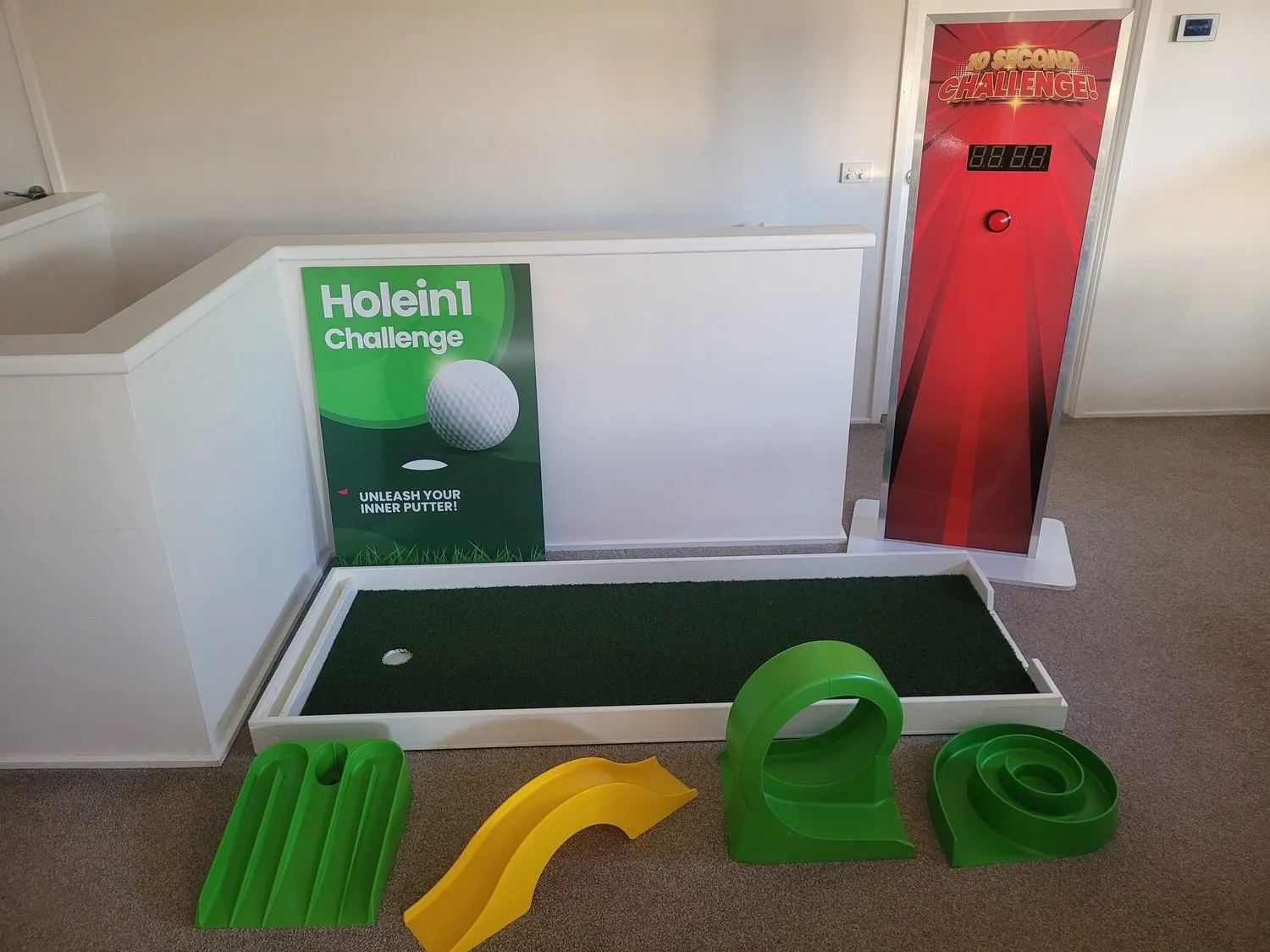Lucky Shot Activation Corner with hole-in-one putting green, four removable obstacles and the 10 Second Challenge