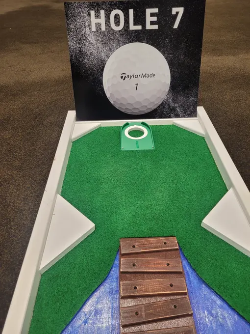 A TaylorMade branded hole on the Lucky Shot mini golf course