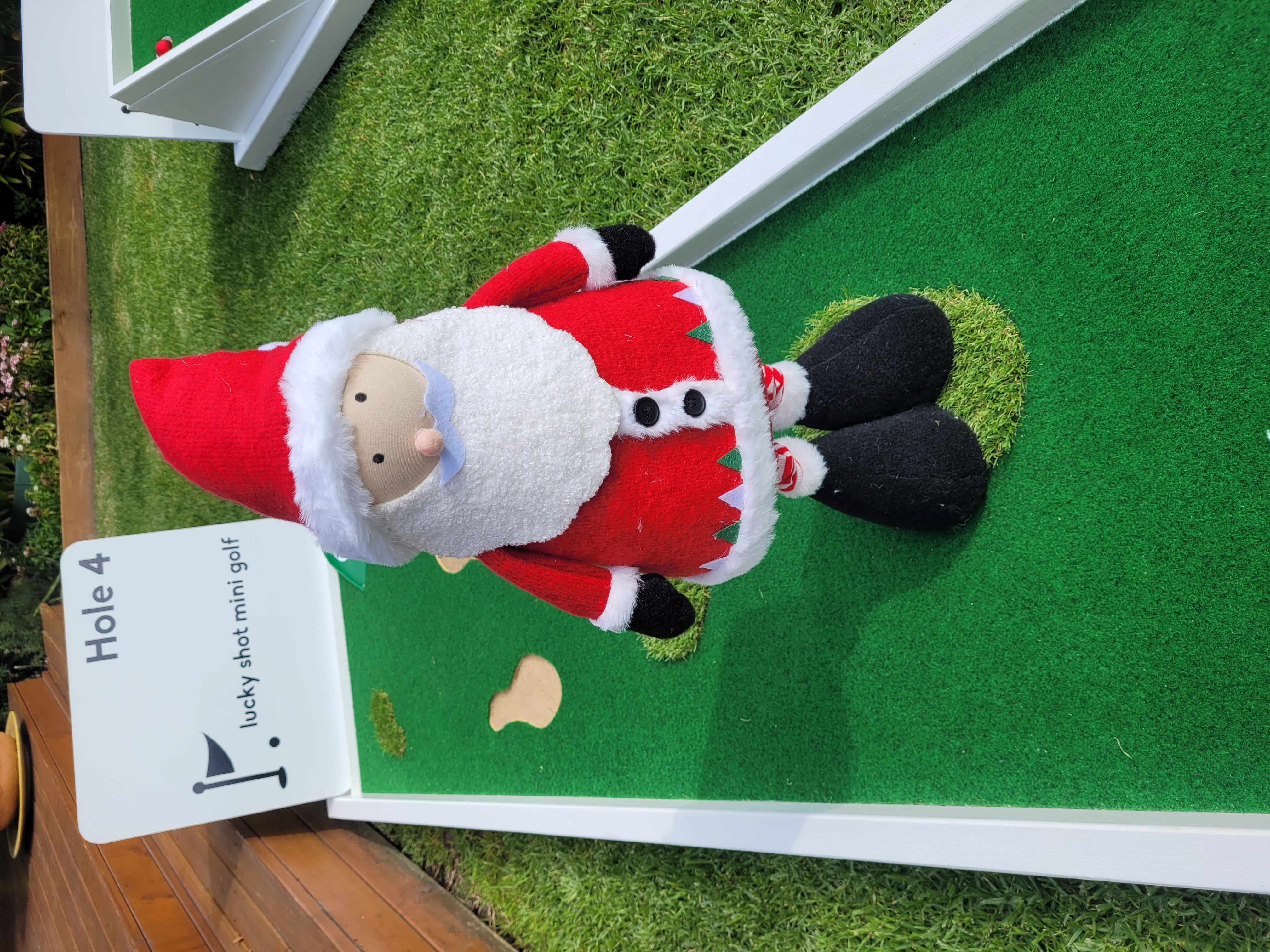 Lucky Shot Christmas in July — Santa figurine on office mini golf course Melbourne