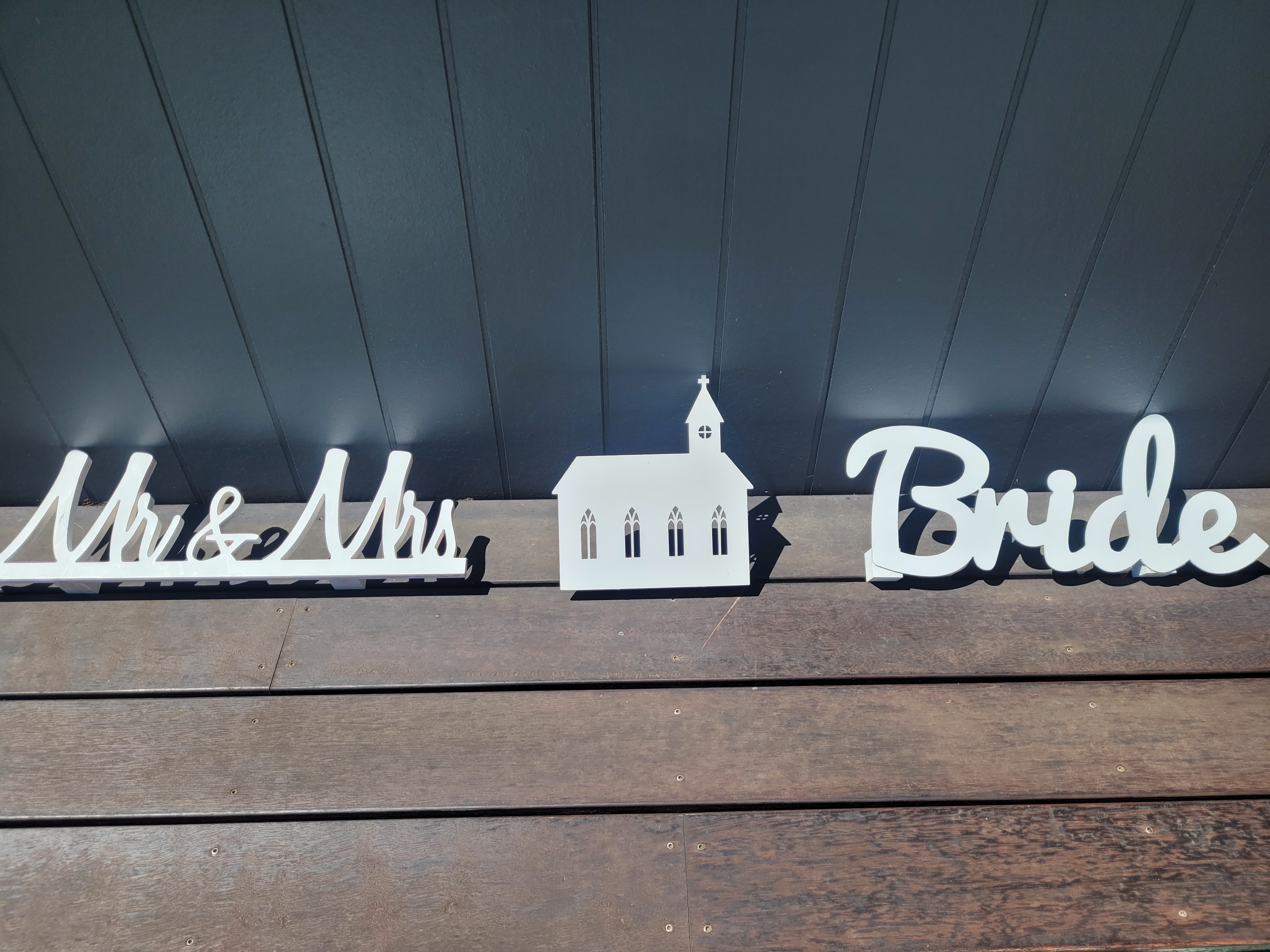 Lucky Shot decorative elements and white wooden cutouts for Melbourne wedding mini golf