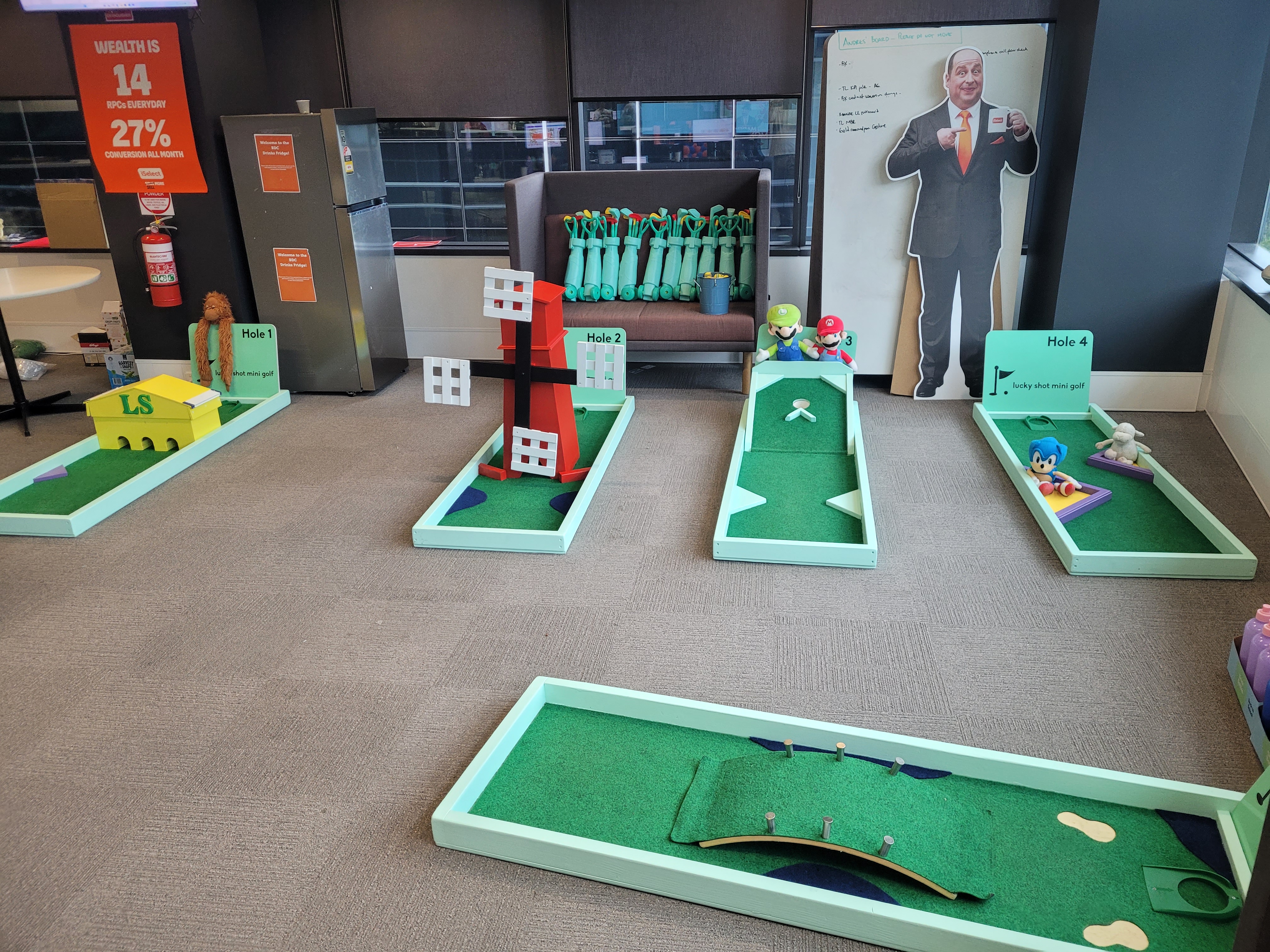 Lucky Shot mini golf installed on carpeted office floor with landscape views — Melbourne