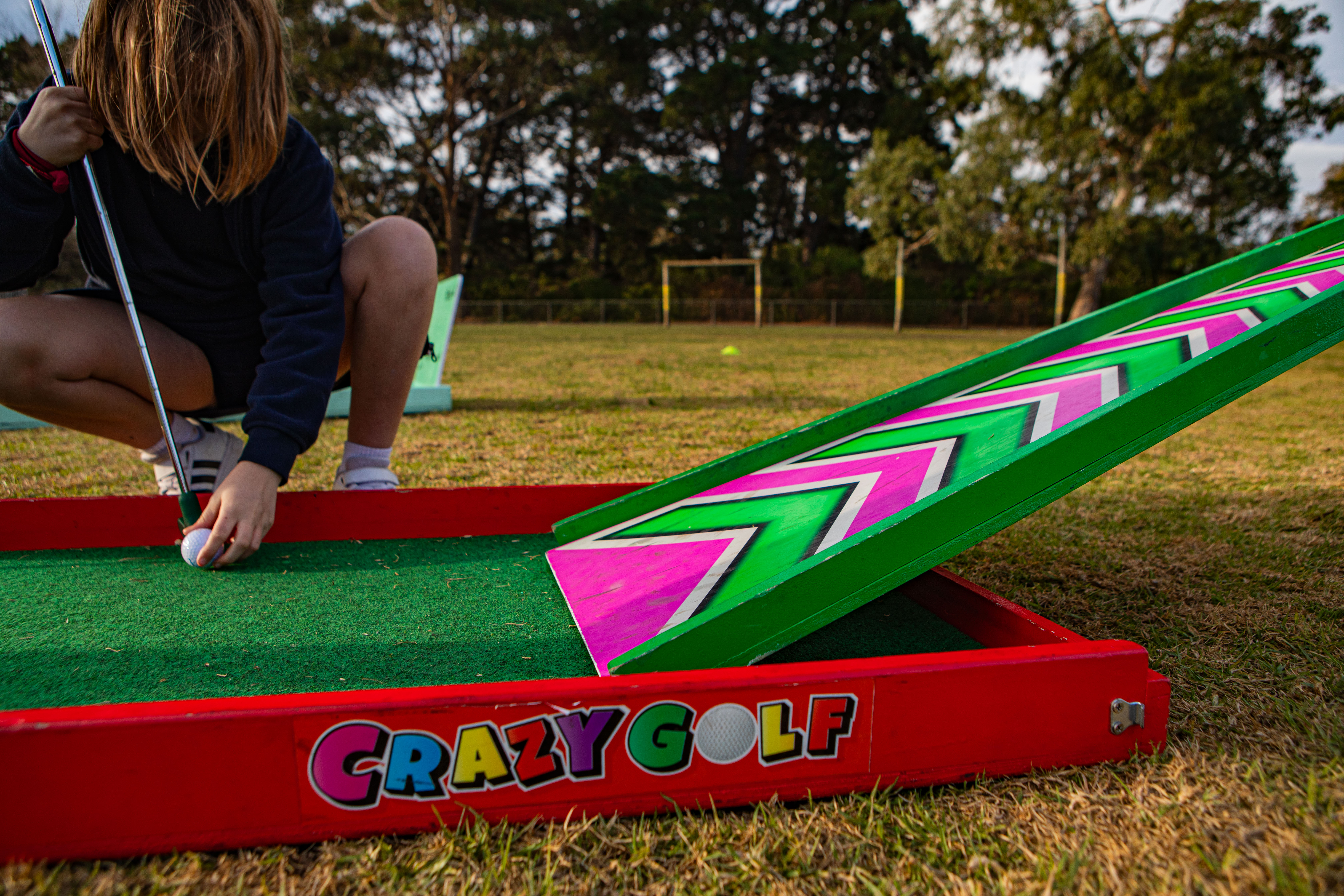 Child playing Lucky Shot mini golf at Melbourne birthday party